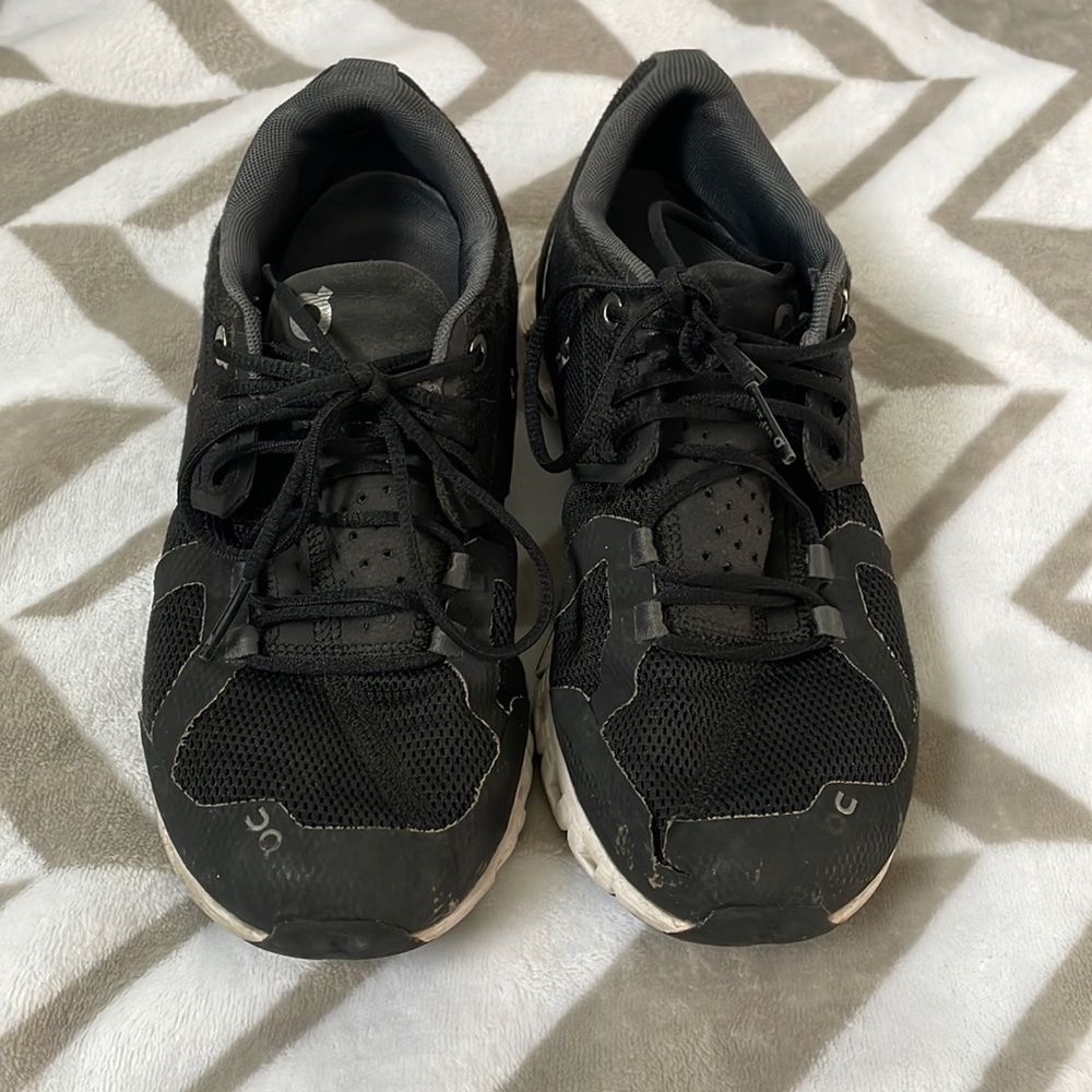 On Cloud shoes with some wear on the left toe